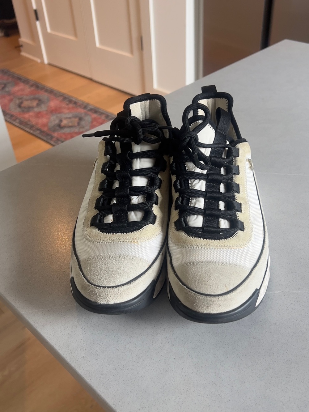 CHANEL Black and White Quilted-Trim Leather & Mesh Sneakers - Picture 2 of 9